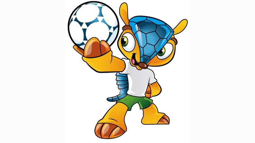 Em 2014, no cenário do Pão de Açúcar, o Brasil apresentou ao mundo Fuleco, que apaixonou os brasileiros e o mundo, como o primeiro tatu-bola a se tornar mascote de uma Copa do Mundo. O nome é a junção de 'futebol' e 'ecologia', refletindo a proposta de unir paixão esportiva e consciência ambiental. Sua couraça simboliza a riqueza da natureza brasileira, que o personagem busca proteger, enquanto o tom azul remete ao céu e às águas repletas de vida do país/ Reprodução Olympics.com