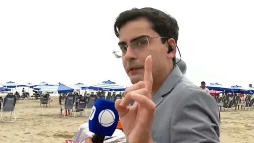 De terno ou de avental? Dudu Camargo encara desafio inusitado e vende pastel na areia em sua estreia na Record /Reprodução