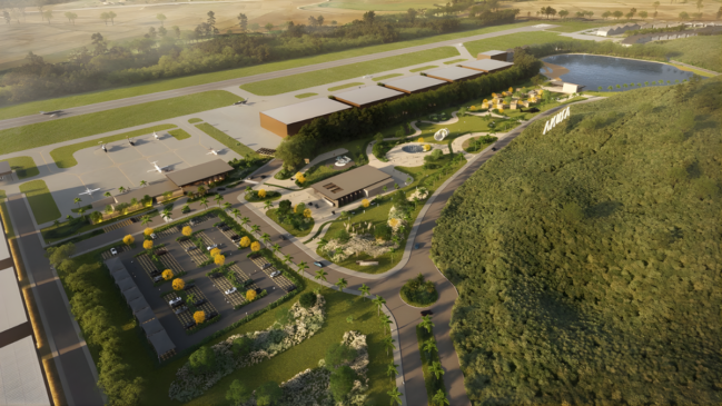 A imagem apresenta a projeção aérea de um moderno complexo aeronáutico integrado à natureza, onde se observa uma pista de pouso e decolagem ao fundo margeada por amplos hangares de design contemporâneo. No centro da composição, destaca-se uma extensa área verde com paisagismo planejado, caminhos sinuosos, jardins e um lago recreativo que confere um aspecto de condomínio de luxo ao empreendimento. Na parte frontal, há um estacionamento organizado e estruturas de apoio com telhados planos, enquanto o entorno é cercado por uma densa vegetação nativa, reforçando o conceito de urbanismo sustentável e infraestrutura executiva de alto padrão.