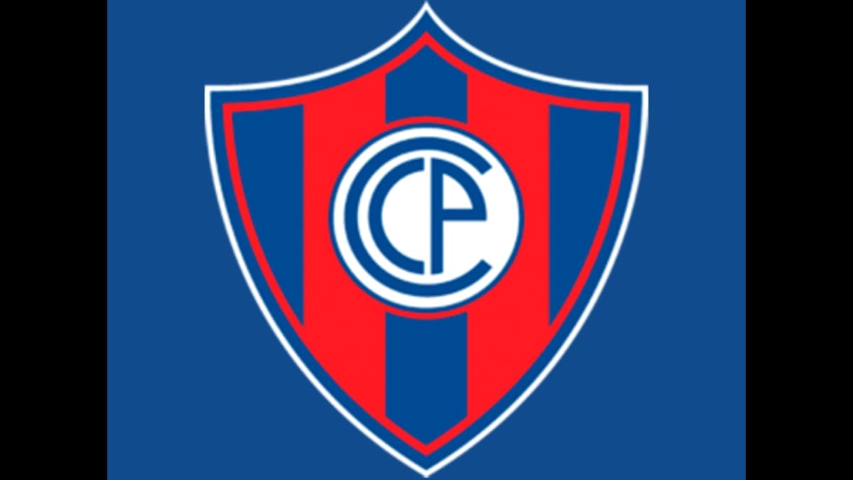 Escudo oficial do Club Cerro Porteño, do Paraguai, em formato de brasão com listras verticais vermelhas e azuis, e um círculo branco central com as iniciais CCP.
