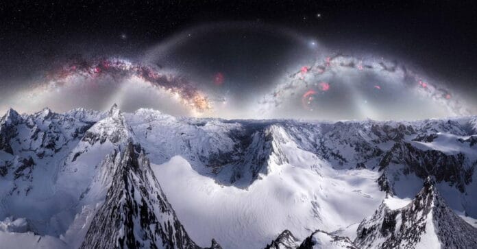 A imagem mostra um impressionante "arco duplo" da Via Láctea sobre as montanhas cobertas de neve próximas ao icônico Matterhorn, um dos picos mais famosos da Europa.