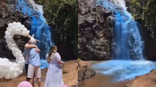 Casal tinge cachoeira