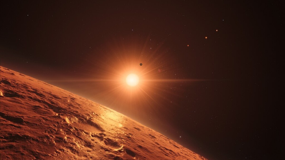 Impressão artística mostra a visão logo acima da superfície de um dos planetas do sistema TRAPPIST-1, a 40 anos-luz da Terra. Sete planetas rochosos e de tamanho semelhante à Terra orbitam essa estrela ultrafria / ESO/N. Bartmann/spaceengine.org
